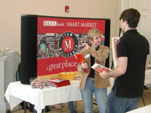 Student talking with a company rep at at career fair